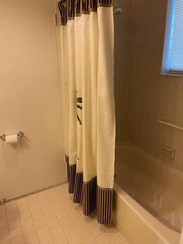 bathroom featuring tile patterned floors and shower / tub combo