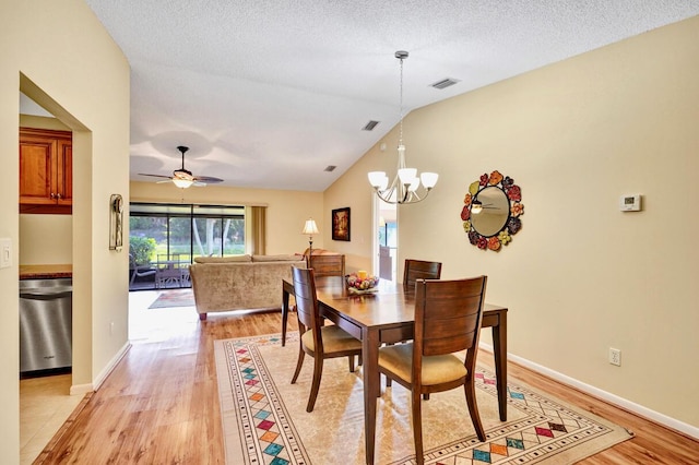 124 Mayfair Ln, Boynton Beach, FL 33426 - dining room with light wood-type flooring, a chandelier, lofted ceiling, and a ceiling fan