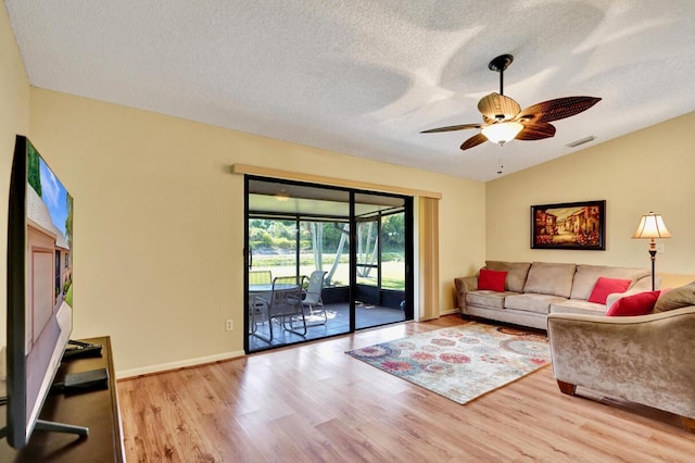 124 Mayfair Ln, Boynton Beach, FL 33426 - living area featuring wood finished floors, ceiling fan, a textured ceiling, and lofted ceiling