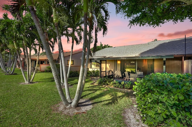 124 Mayfair Ln, Boynton Beach, FL 33426 - back of property featuring a yard and a shingled roof