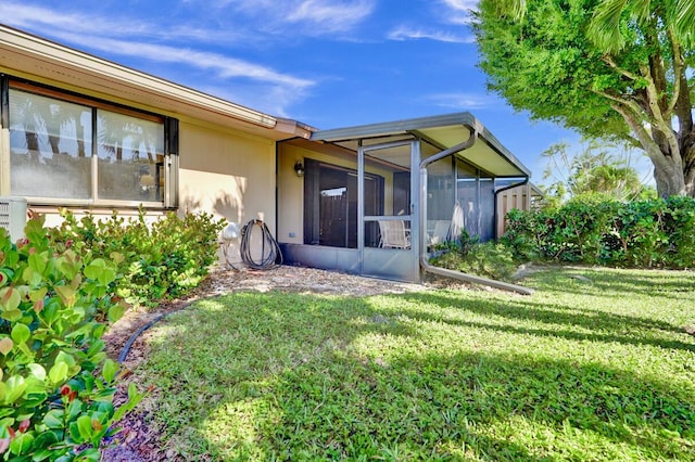 124 Mayfair Ln, Boynton Beach, FL 33426 - back of property with a lawn and a sunroom