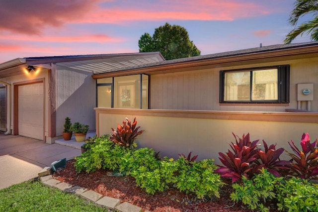 124 Mayfair Ln, Boynton Beach, FL 33426 - view of front of home featuring concrete driveway and an attached garage