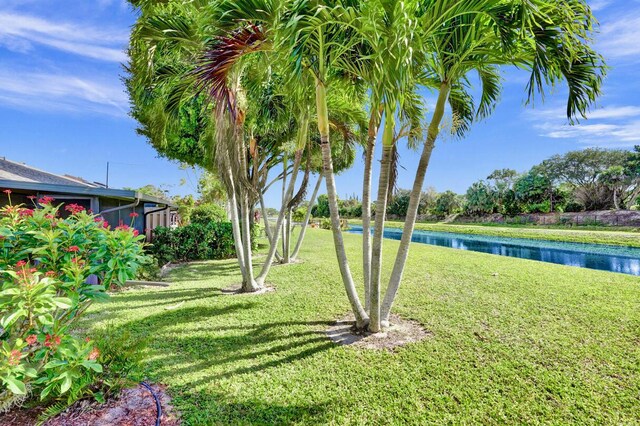 124 Mayfair Ln, Boynton Beach, FL 33426 - view of green lawn featuring a water view