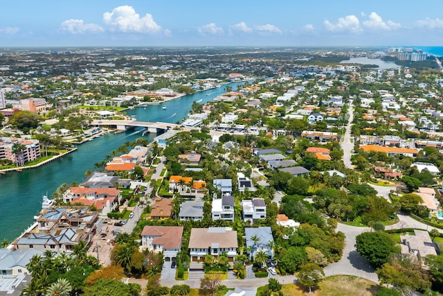 drone / aerial view with a water view and a residential view