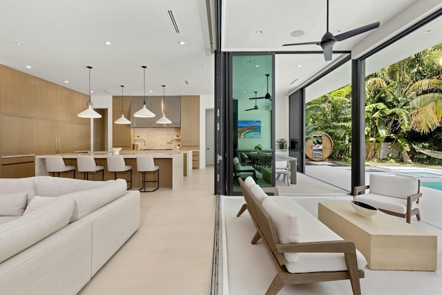 living room featuring recessed lighting, a ceiling fan, and visible vents