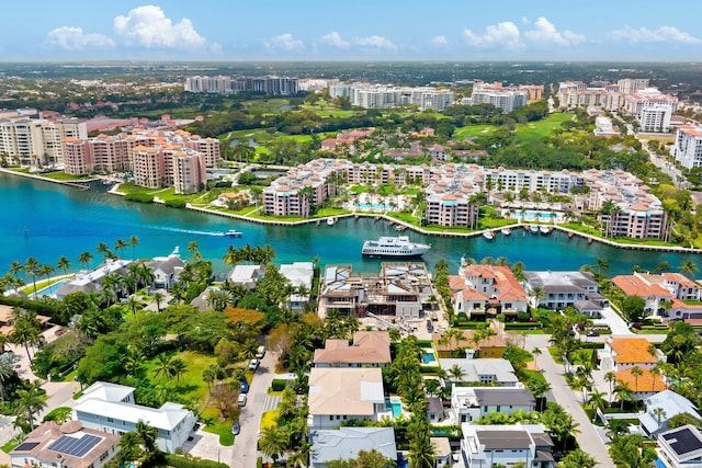 drone / aerial view featuring a view of city and a water view