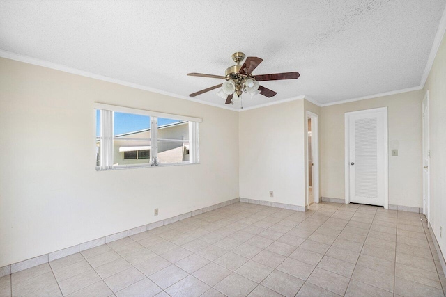 spare room with a textured ceiling, crown molding, and ceiling fan