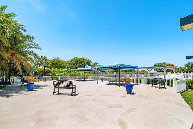 view of community featuring fence