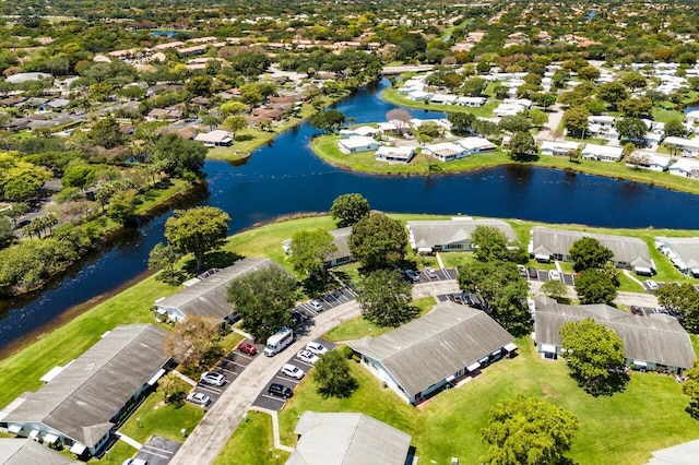drone / aerial view featuring a water view and a residential view