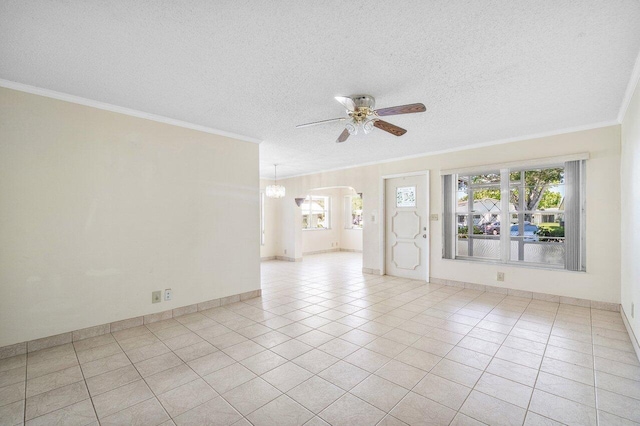 unfurnished room featuring crown molding, a wealth of natural light, a textured ceiling, and ceiling fan with notable chandelier
