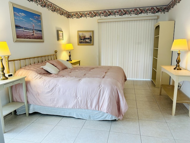 bedroom featuring tile patterned flooring