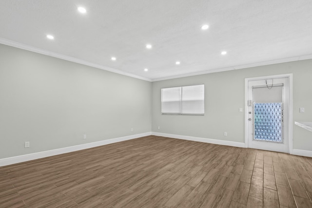 116 Seville D, Delray Beach, FL 33446 - spare room with crown molding, baseboards, recessed lighting, and wood finished floors