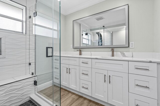 116 Seville D, Delray Beach, FL 33446 - full bath featuring a sink, visible vents, a stall shower, and crown molding