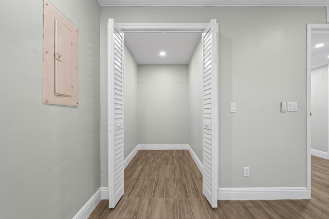 116 Seville D, Delray Beach, FL 33446 - hall with baseboards, recessed lighting, wood finished floors, and electric panel