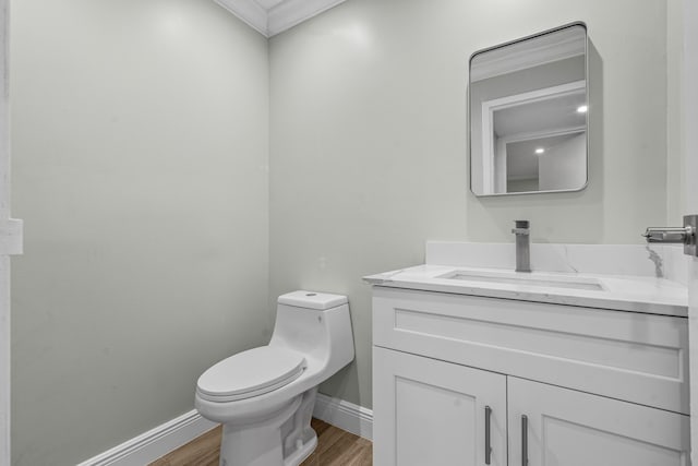 116 Seville D, Delray Beach, FL 33446 - bathroom featuring vanity, baseboards, toilet, and wood finished floors