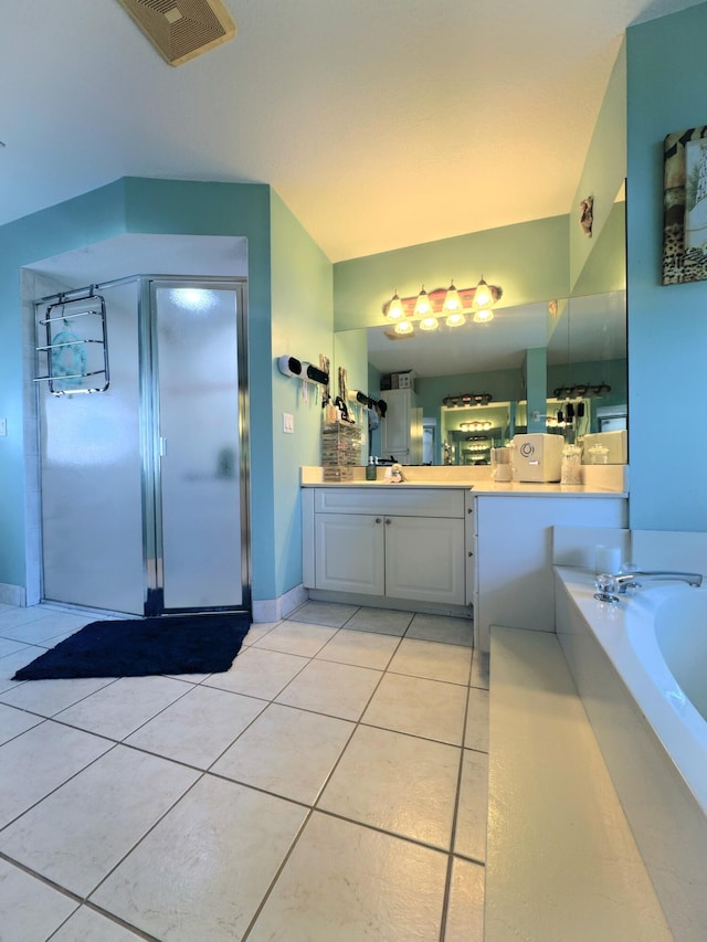 bathroom featuring vanity, tile patterned flooring, a shower stall, visible vents, and a garden tub