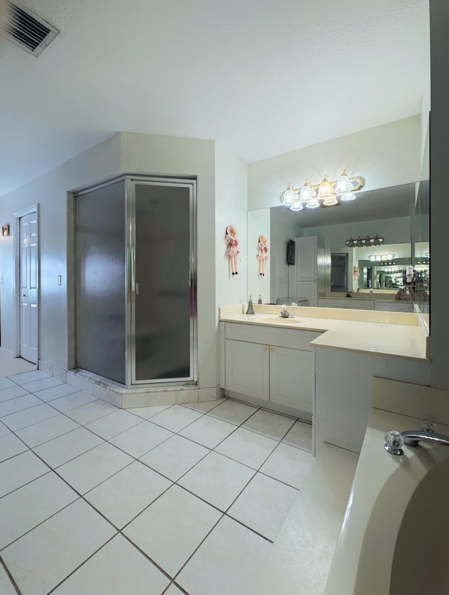 full bath with tile patterned floors, vanity, visible vents, and a stall shower