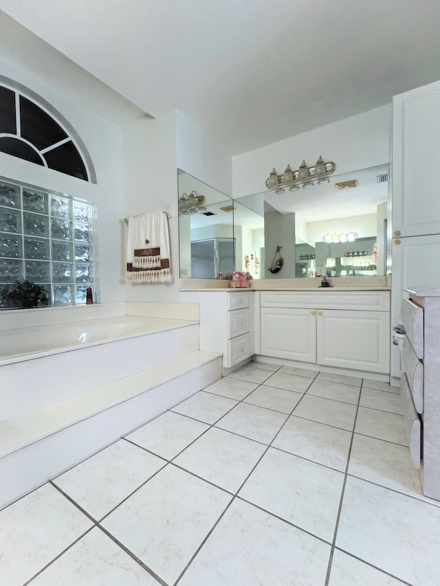 bathroom with tile patterned floors and vanity