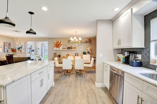 6122 Overland Pl, Delray Beach, FL 33484 - kitchen featuring a chandelier, backsplash, white cabinets, light wood finished floors, and dishwasher