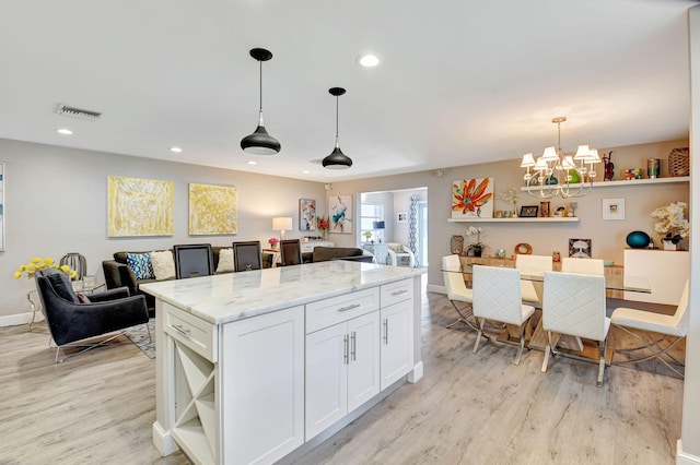6122 Overland Pl, Delray Beach, FL 33484 - kitchen with visible vents, open floor plan, open shelves, and light wood-style floors