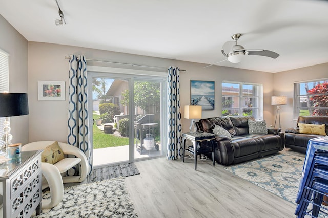 6122 Overland Pl, Delray Beach, FL 33484 - living area with track lighting, ceiling fan, and wood finished floors