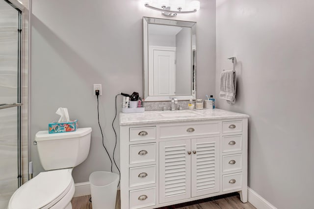 6122 Overland Pl, Delray Beach, FL 33484 - bathroom featuring vanity, baseboards, toilet, and wood finished floors
