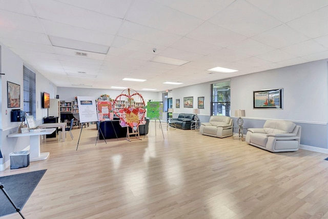 6122 Overland Pl, Delray Beach, FL 33484 - misc room featuring wood finished floors, visible vents, a drop ceiling, and baseboards