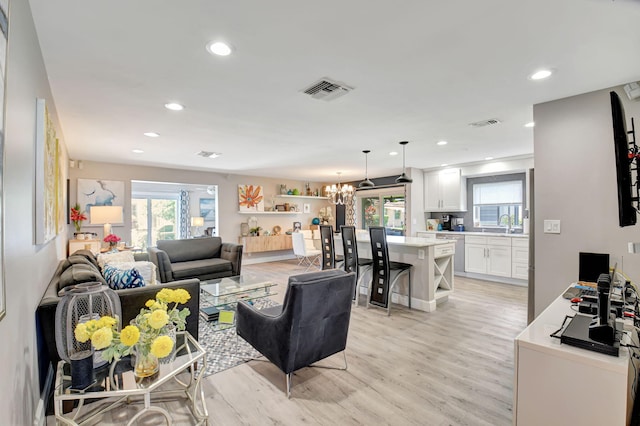 6122 Overland Pl, Delray Beach, FL 33484 - living room featuring recessed lighting, a notable chandelier, light wood-style flooring, and visible vents