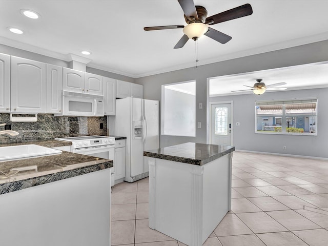 kitchen featuring a sink, tile countertops, white appliances, light tile patterned floors, and ceiling fan