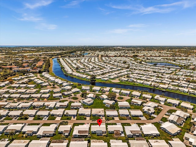 birds eye view of property featuring a residential view and a water view