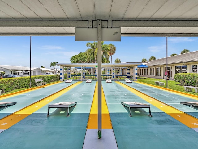 view of property's community featuring shuffleboard