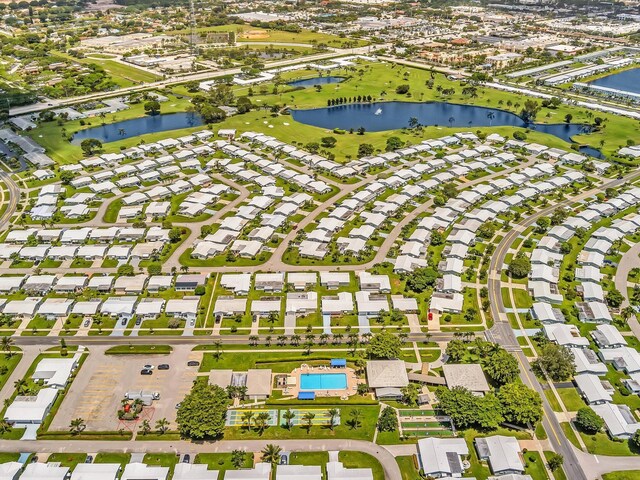 aerial view with a residential view and a water view