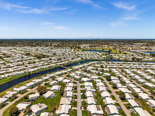 birds eye view of property with a residential view and a water view