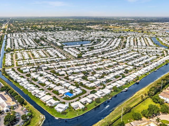 birds eye view of property featuring a residential view and a water view