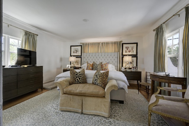 359 E Lakewood Rd, West Palm Beach, FL 33405 - bedroom featuring baseboards, wood finished floors, and ornamental molding