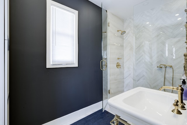 359 E Lakewood Rd, West Palm Beach, FL 33405 - full bath featuring a sink, baseboards, and a shower stall