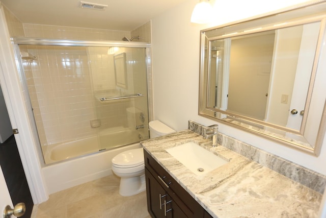 full bath with vanity, toilet, shower / bath combination with glass door, and visible vents