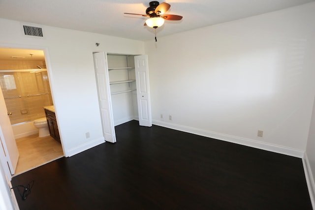 7290 Kinghurst Dr Unit 407, Delray Beach, FL 33446 - unfurnished bedroom featuring wood finished floors, a closet, and ceiling fan