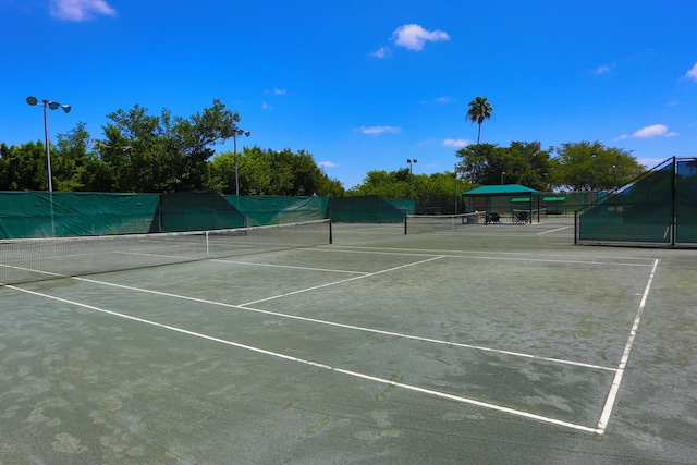 view of sport court featuring fence