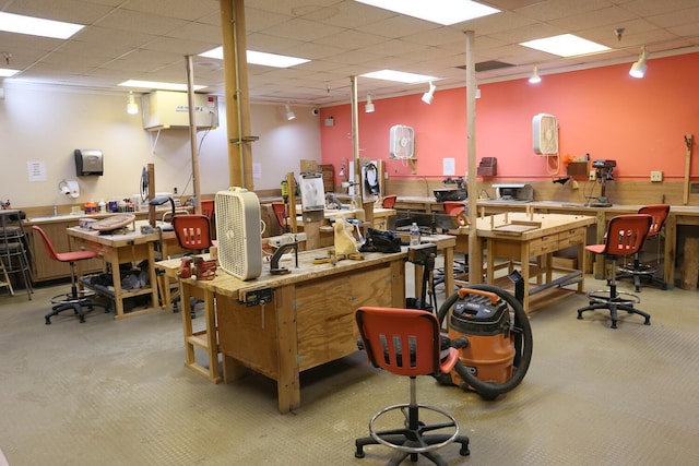 misc room with track lighting, carpet, and a workshop area
