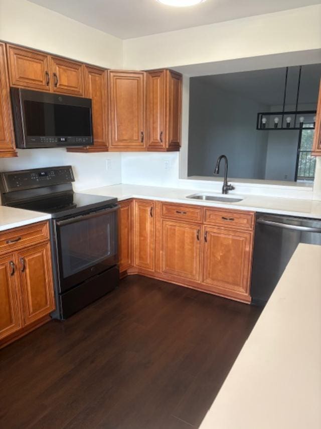 7290 Kinghurst Dr Unit 407, Delray Beach, FL 33446 - kitchen with black / electric stove, stainless steel dishwasher, a sink, and light countertops