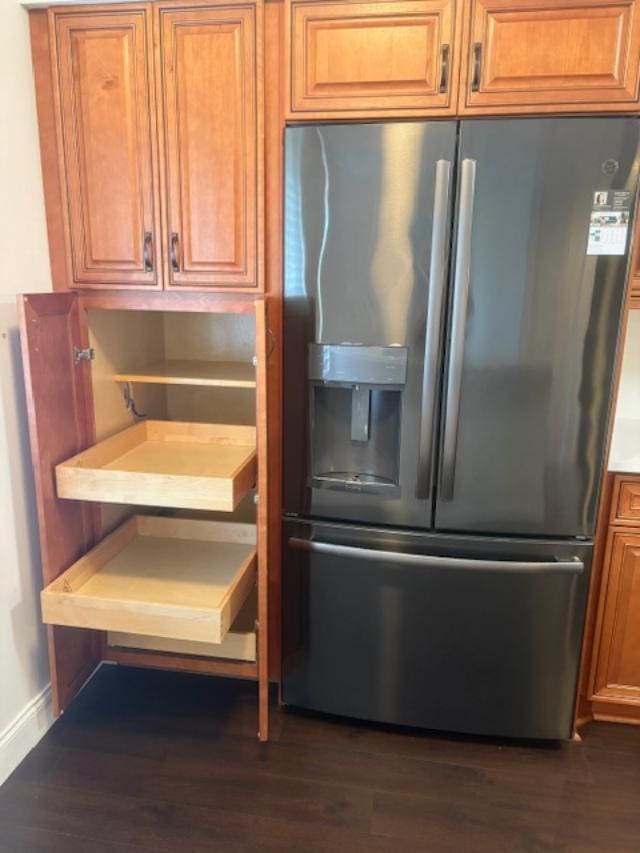 7290 Kinghurst Dr Unit 407, Delray Beach, FL 33446 - kitchen featuring black appliances and brown cabinetry