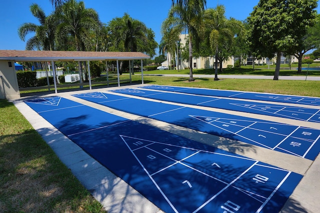 7290 Kinghurst Dr Unit 407, Delray Beach, FL 33446 - view of community featuring a lawn, uncovered parking, and shuffleboard
