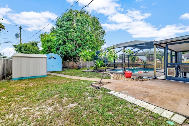 view of yard with a fenced backyard, an outdoor structure, a shed, and a lanai