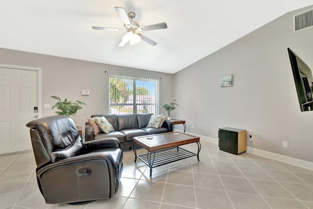 living room featuring light tile patterned floors, visible vents, vaulted ceiling, and ceiling fan