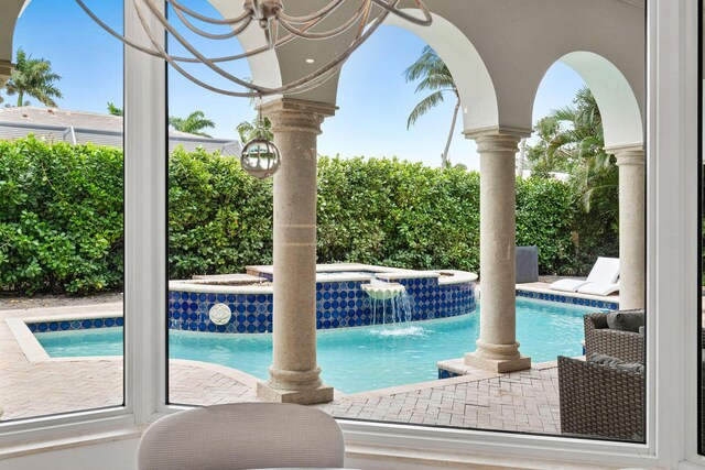 outdoor pool with an in ground hot tub