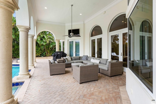 view of patio / terrace featuring french doors, an outdoor pool, a ceiling fan, and an outdoor living space