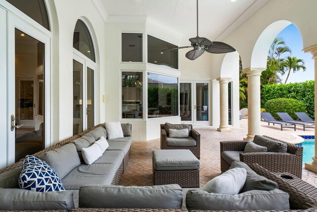 view of patio featuring an outdoor hangout area, french doors, a fenced in pool, and ceiling fan