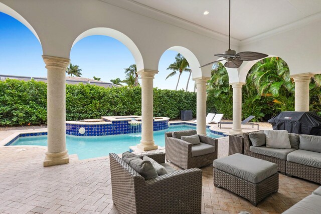view of swimming pool featuring a patio, an outdoor hangout area, a fenced in pool, and an in ground hot tub