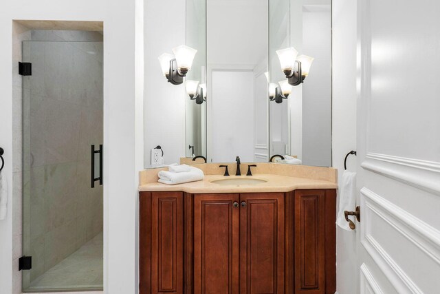 bathroom with vanity and a stall shower